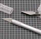 Escarpelo metálico con 5 cuchillas de repuesto